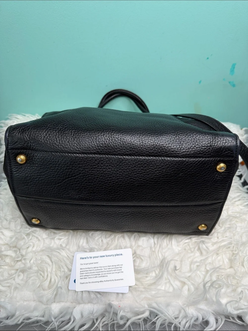 Authentic Prada Black  Leather Satchel with Gold Logo .